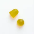 Close-up of two lemon-flavoured HEKA Immunity Kids gummies